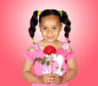 Smiling little girl with a red rose
