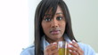 Black woman drinking tea in robe