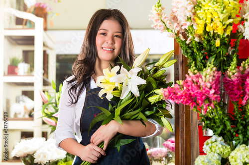 Photo: Female Florist holding a Bouquet Female Florist holding a Bouquet