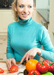 Cheerful young woman cooking