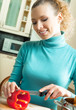 Photo: Cheerful young woman cooking Cheerful young woman cooking