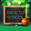 Back to school, written on blackboard with chalk,