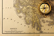 Antique compass over old XIX century map