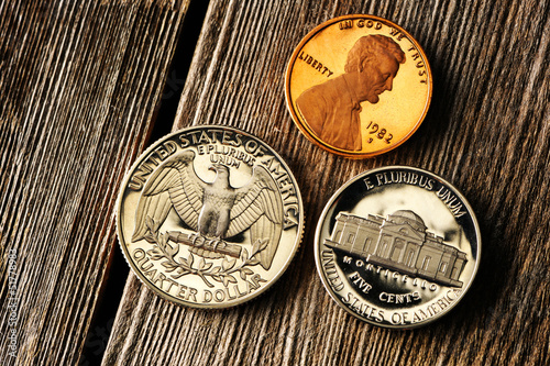 Photo: US cent coins over wooden background US cent coins over wooden background