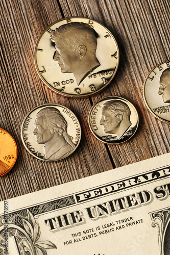 Photo: US money over wooden background US money over wooden background