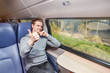 Foto: Passenger in train showing thumb up Passenger in train showing thumb up