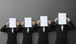 Photo: people standing with on boards people standing with on boards