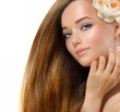 Beauty Girl. Beautiful Model with Rose Flower Touching her Face