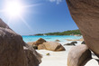White coral beach sand and azure indian ocean. Sailing yacht on
