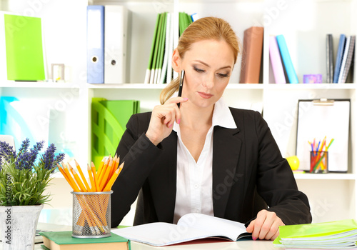 Photo: Portrait of teacher woman working in classroom Portrait of teacher woman working in classroom