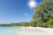 White coral beach sand and azure indian ocean.