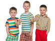 Photo: Three happy cute boys holding thumbs up Three happy cute boys holding thumbs up