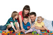 Family are playing with children on the floor