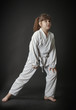 Preteen girl exercising karate
