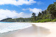 White coral beach sand and azure indian ocean.