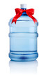Big bottle of water tied with a red satin ribbon bow Isolated on