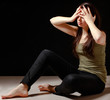 Depressed woman sitting on floor