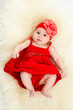 top view of beautiful baby in red dress