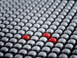 Red ball among white spheres, standing out in the crowd concept
