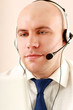 Photo: A call center employee sitting at the desk A call center employee sitting at the desk