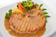 Photo: Grilled pork steak with vegetables and gravy sauce Grilled pork steak with vegetables and gravy sauce