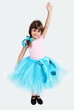 Smiling Girl in Tutu Skirt Hand Up