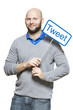 Young man holding a social media sign smiling