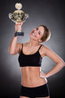 Young Woman Lifting Trophy
