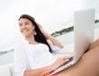 Foto: Woman social networking on a boat Woman social networking on a boat