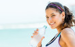Sports woman drinking water