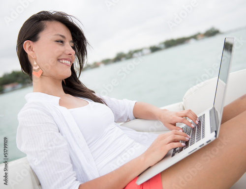 Photo: Woman sailing on a boat Woman sailing on a boat