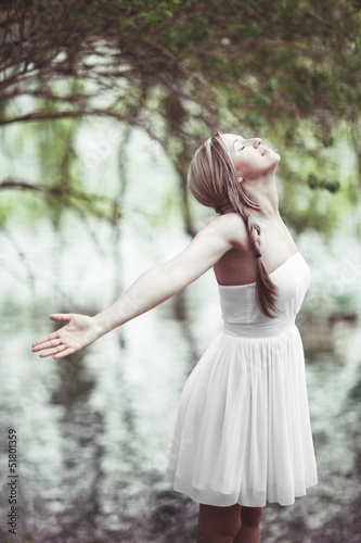 Photo: Beautiful woman rejoicing in the joys of nature Beautiful woman rejoicing in the joys of nature