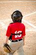 Photo: Child playing catcher during baseball game Child playing catcher during baseball game