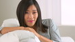 Chinese woman relaxing on couch