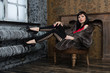 Fashionable young woman posing in a vintage interior