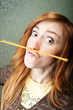 Funny young woman with spaghetti mustache