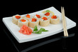 Rolls with red caviar and sesame
