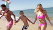 Family Running Out Of Sea