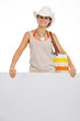 Happy beach young woman showing blank billboard