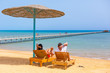 Relax of loving couple on the beach at Red Sea in Egypt