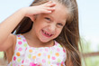 Funny toothless little girl outdoors