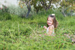 Funny little girl running in the park