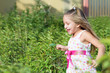 Funny little girl running in the park
