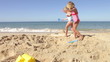 Two Young Girls Playing On Beach Together