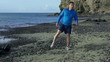 Young man stretching on the seashore, slow motion shot at 240fps