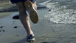 Young man jogging on the beach, slow motion shot at 240fps 