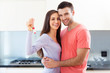 Couple with keys to new home