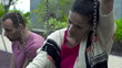 Sad couple sitting on a swing, slow motion shot at 240fps 