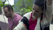 Sad couple sitting on a swing, slow motion shot at 60fps 