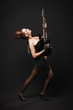 Rock female with guitar over dark background.